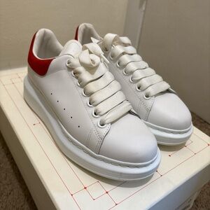 White Sneakers with Red Accents